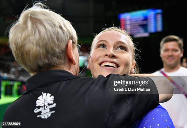 Elsabeth Black of Canada is congratulated as she wins gold in the Women's Individual All-Around Final during Gymnastics on day three of the Gold...