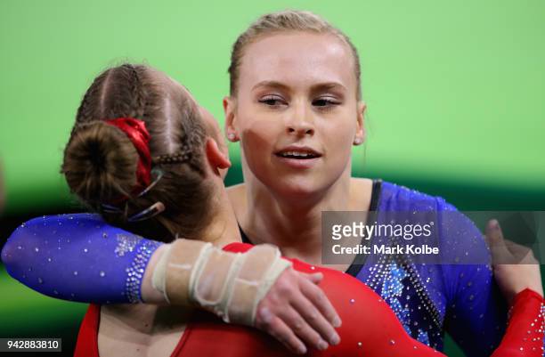 Elsabeth Black of Canada is congratulated as she wins gold in the Women's Individual All-Around Final during Gymnastics on day three of the Gold...