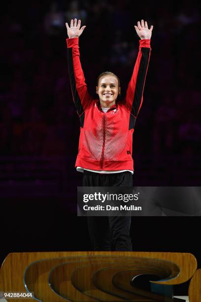 Gold medalist Elsabeth Black of Canada celebrates during the medal ceremony for the Women's Individual All-Around Final during Gymnastics on day...