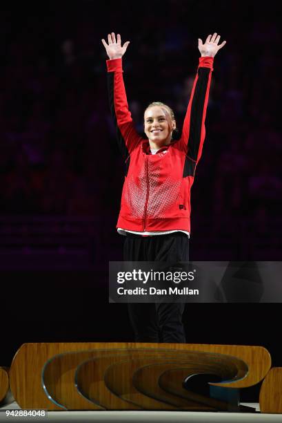 Gold medalist Elsabeth Black of Canada celebrates during the medal ceremony for the Women's Individual All-Around Final during Gymnastics on day...