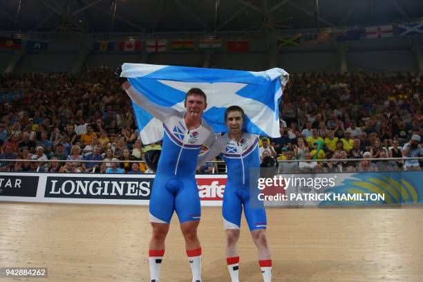 Scotland's Neil Fachie and pilot Matt Rotherham celebrate winning gold in the men's B&VI sprint cycling finals during the 2018 Gold Coast...