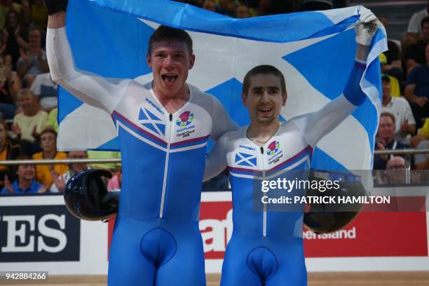 Scotland's Neil Fachie and pilot Matt Rotherham celebrate winning gold in the men's B&VI sprint cycling finals during the 2018 Gold Coast...