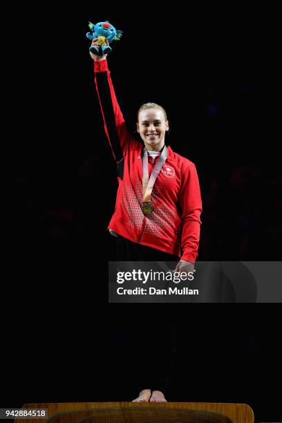 Gold medalist Elsabeth Black of Canada celebrates during the medal ceremony for the Women's Individual All-Around Final during Gymnastics on day...