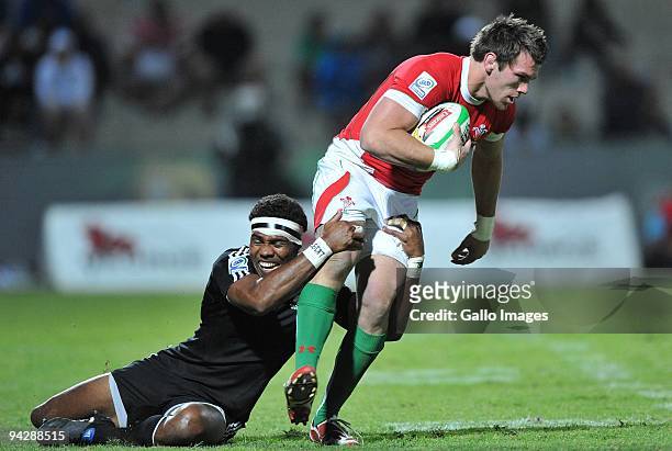 Chris Davies of Wales tackled by Lote Raikabula of New Zealand during the IRB Sevens Series match between New Zealand and Wales at Quteniqua Park on...