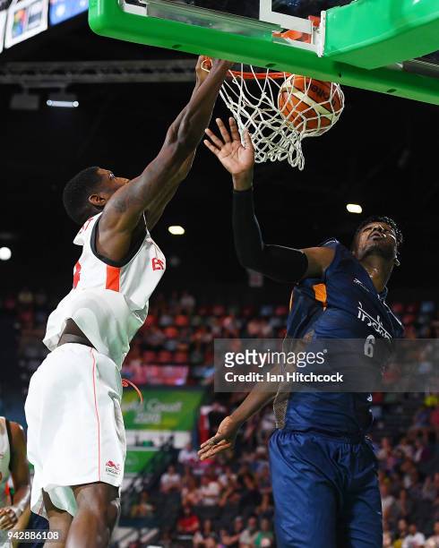 Robert Gilchrist of England slam dunks the ball during the Preliminary Basketball round match between England and India on day three of the Gold...