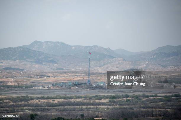 View of Kaesong City with a North Korean flag in North Korea is seen from Dora Observatory inside the fortified Demilitarised Zone on April 7, 2018...