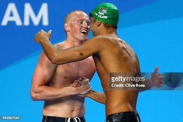 Chad le Clos of South Africa and David Morgan of Australia embrace following the Men's 200m Butterfly Final on day three of the Gold Coast 2018...
