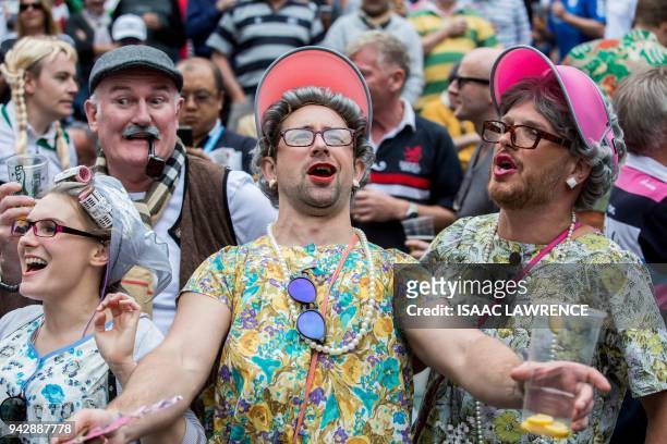 Fans attend the second day of the Hong Kong rugby sevens tournament in Hong Kong on April 7, 2018. / AFP PHOTO / Isaac LAWRENCE