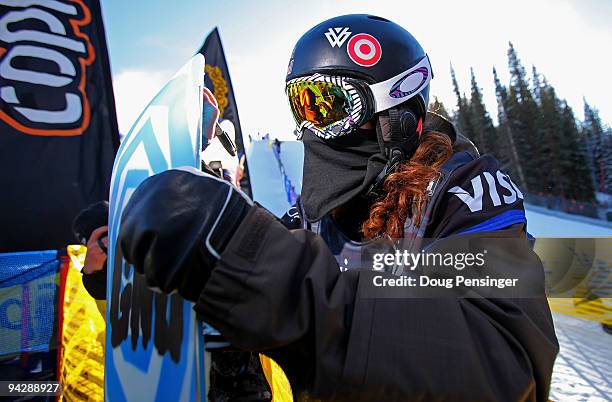 Shaun White of the USA signs an autograph after taking a run in the US Snowboarding Grand Prix Men's Qualifier on the Main Vein Half Pipe on December...