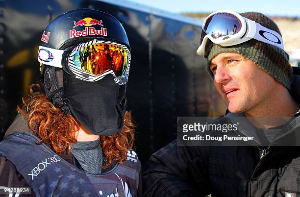 Shaun White of the USA talks with his agent Mark Ervin after taking a run in the US Snowboarding Grand Prix Men's Qualifier on the Main Vein Half...