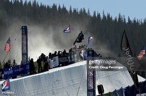 General view of the half pipe as a competitor soars above the heads of the spectators during the US Snowboarding Grand Prix Men's Qualifier on the...