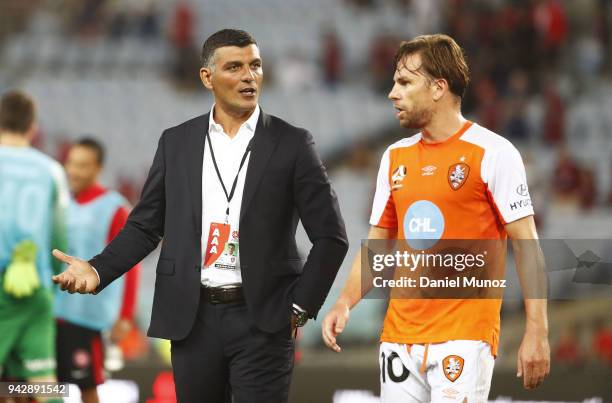 Roar coach John Aloisi talks to Brett Holman after losing the round 26 A-League match between the Western Sydney Wanderers and the Brisbane Roar at...