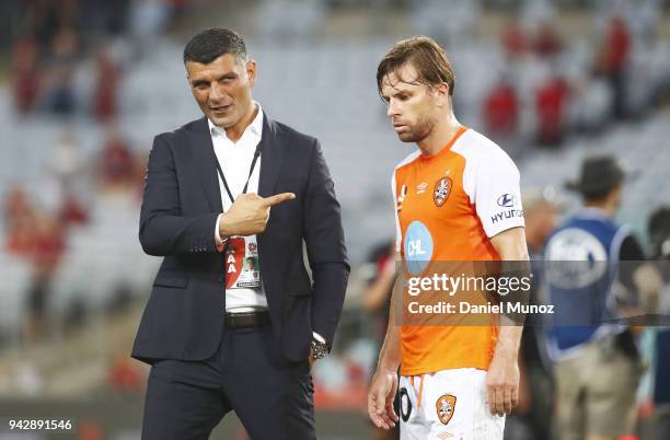 Roar coach John Aloisi talks to Brett Holman after losing the round 26 A-League match between the Western Sydney Wanderers and the Brisbane Roar at...