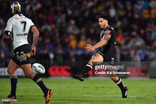 Shaun Johnson of the Warriors kicks the ball during the round five NRL match between the New Zealand Warriors and the North Queensland Cowboys at Mt...