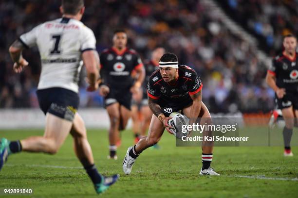 Jazz Tevaga of the Warriors charges forward during the round five NRL match between the New Zealand Warriors and the North Queensland Cowboys at Mt...