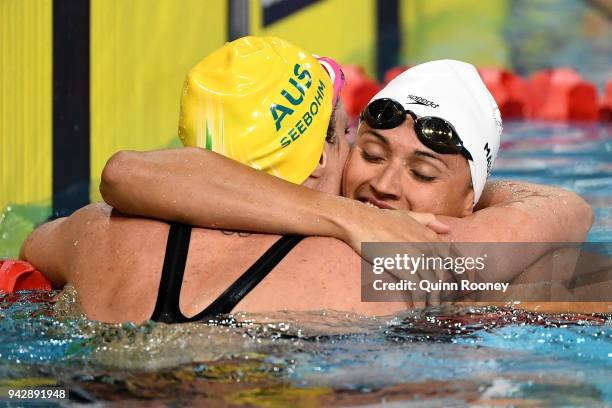 Kylie Masse of Canada and Emily Seebohm of Australia embrace following the Women's 100m Backstroke Final on day three of the Gold Coast 2018...