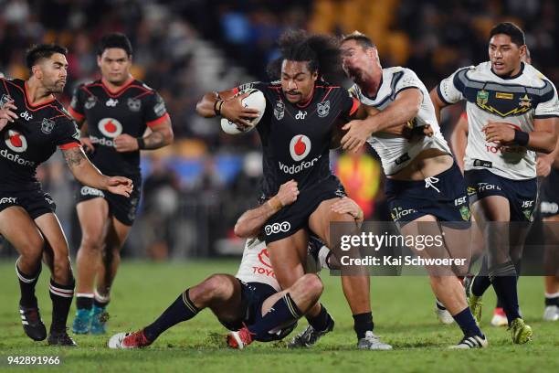 Bunty Afoa of the Warriors is tackled during the round five NRL match between the New Zealand Warriors and the North Queensland Cowboys at Mt Smart...