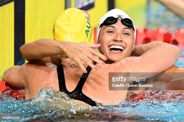 Kylie Masse of Canada and Emily Seebohm of Australia embrace following the Women's 100m Backstroke Final on day three of the Gold Coast 2018...