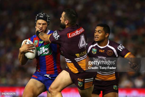 Kalyn Ponga of the Knights is tackled during the round five NRL match between the Newcastle Knights and the Brisbane Broncos at McDonald Jones...