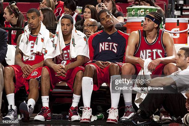 Courtney Lee, Devin Harris, Sean Williams and Josh Boone of the New Jersey Nets looks on dejected from the bench during the game against the Portland...