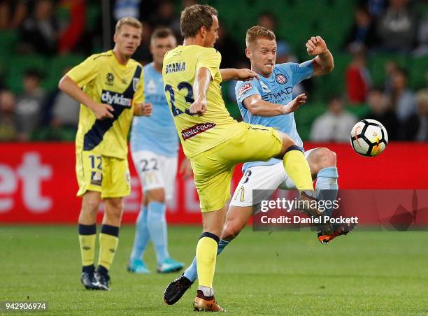 Oliver Bozanic of Melbourne City and Wout Brama of Central Coast Mariners contest the ball during the round 26 A-League match between Melbourne City...