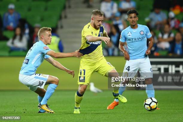 Connor Pain of the Mariners runs with the ball during the round 26 A-League match between Melbourne City and the Central Coast Mariners at AAMI Park...