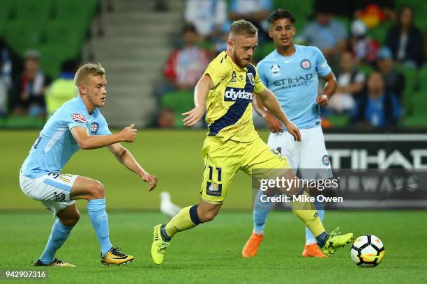 Connor Pain of the Mariners runs with the ball during the round 26 A-League match between Melbourne City and the Central Coast Mariners at AAMI Park...