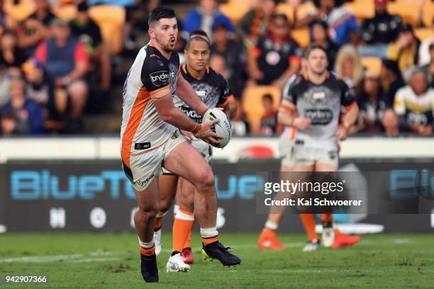 Matthew Eisenhuth of the Tigers charges forward during the round five NRL match between the Wests Tigers and the Melbourne Storm at Mt Smart Stadium...