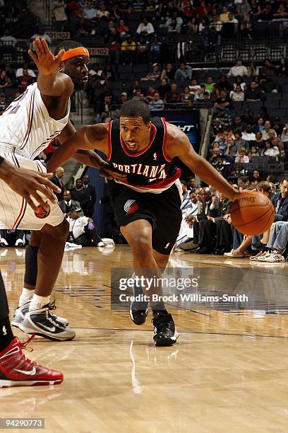 Andre Miller of the Portland Trail Blazers makes a move to the basket against Ronald Murray of the Charlotte Bobcats during the game at Time Warner...