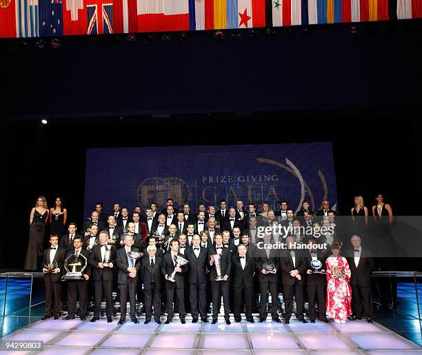 In this handout image provided by FIA, FIA trophy winners pose during the 2009 FIA Gala Prize Giving Ceremony held at the Salle des Etoiles Sporting...