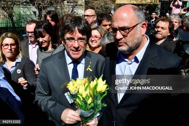 Catalonia's ousted leader Carles Puigdemont leaves the venue after a press conference on April 7, 2018 in Berlin after judges refused his extradition...