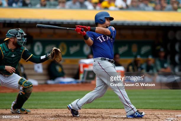 Juan Centeno of the Texas Rangers at bat against the Oakland Athletics during the second inning at the Oakland Coliseum on April 5, 2018 in Oakland,...