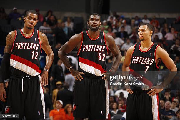 LaMarcus Aldridge, Greg Oden and Brandon Roy of the Portland Trail Blazers stand on the court during the game against the Charlotte Bobcats at Time...