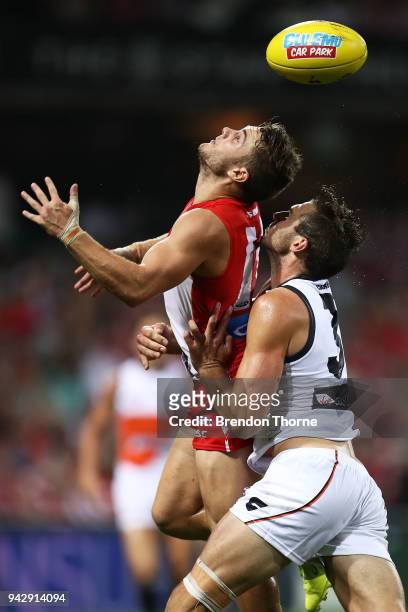 Tom Papley of the Swans contests the ball with Jeremy Finlayson of the Giants during the round three AFL match between the Sydney Swans and the...