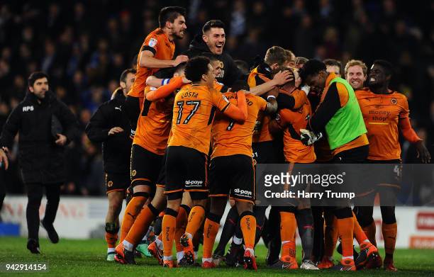 The players and Nuno Espirito Santo, Manager of Wolverhampton Wanderers celebrate with keeper John Ruddy of Wolverhampton Wanderers after he saves...