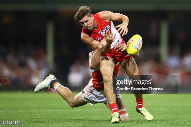 Jake Lloyd of the Swans contests the ball with Jeremy Finlayson of the Giants during the round three AFL match between the Sydney Swans and the...