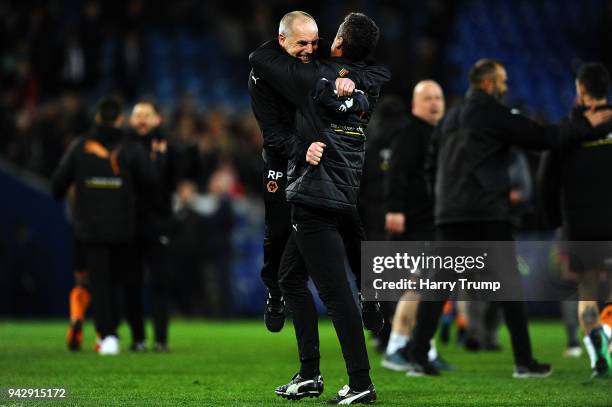 Members of the Wolverhampton Wanderers coaching staff celebrate victory during the Sky Bet Championship match between Cardiff City and Wolverhampton...