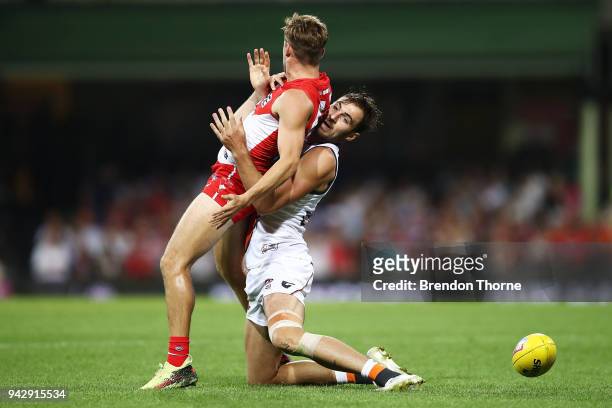 Jake Lloyd of the Swans contests the ball with Jeremy Finlayson of the Giants during the round three AFL match between the Sydney Swans and the...