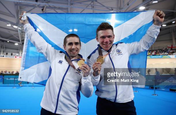 Gold medalists Neil Fachie of Scotland and pilot Matt Rotherham celebrate during the medal ceremony for the Men's B&VI Sprint Gold Final on day three...