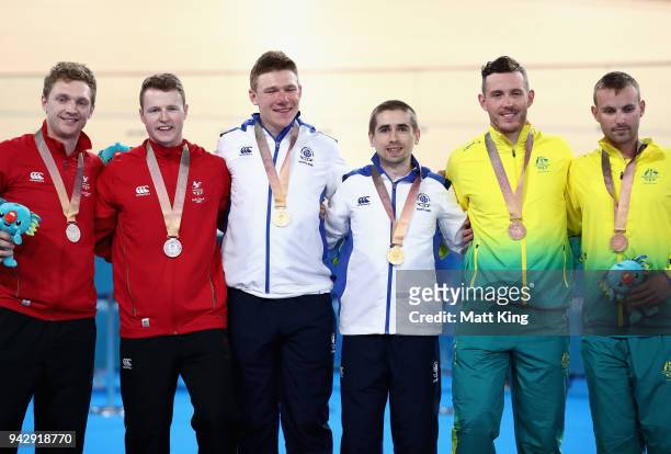 Silver medalists James Ball of Wales and pilot Peter Mitchell, gold medalists Neil Fachie of Scotland and pilot Matt Rotherham and bronze medalists...