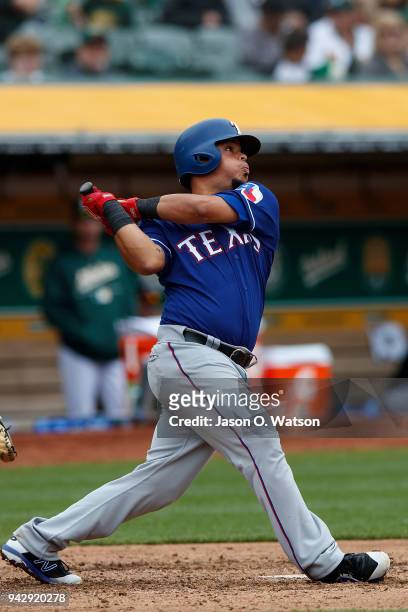Juan Centeno of the Texas Rangers at bat against the Oakland Athletics during the fifth inning at the Oakland Coliseum on April 5, 2018 in Oakland,...