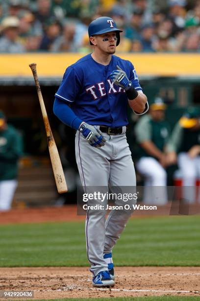 Ryan Rua of the Texas Rangers reacts after striking out against the Oakland Athletics during the fourth inning at the Oakland Coliseum on April 5,...