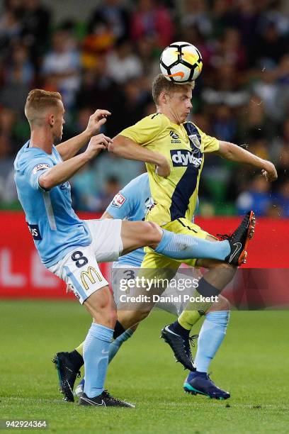 Oliver Bozanic of Melbourne City and Trent Buhagiar of Central Coast Mariners contest the ball during the round 26 A-League match between Melbourne...