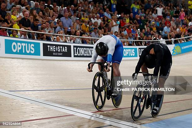 New Zealand's Sam Webster leads moments before crossing the line to win gold against Scotland's Jack Carlin who won silver in the men's sprint finals...