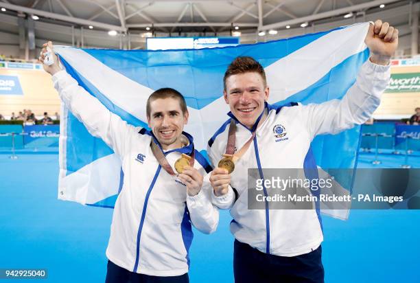 Scotland's Neil Fachie and pilot Matt Rotherham celebrate with their gold medals after the Men's B&VI Sprint Final at the Anna Meares Velodrome...