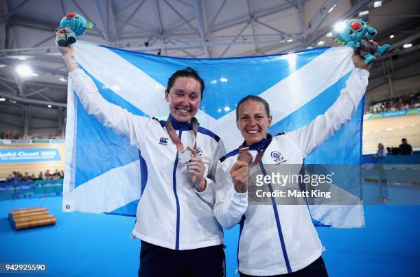 Silver medalist Katie Archibald of Scotland and bronze medalist Neah Evans of Scotland celebrate during the medal ceremony for the Women's 25km...
