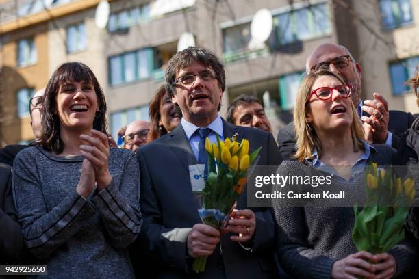 Catalan separatist leader Carles Puigdemont , Elsa Artardi and Aurora Madula pose for the media the day after his release from a German prison on...