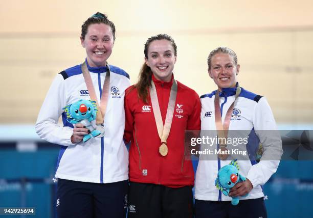 Silver medalist Katie Archibald of Scotland, gold medalist Elinor Barker of Wales and bronze medalist Neah Evans of Scotland pose during the medal...