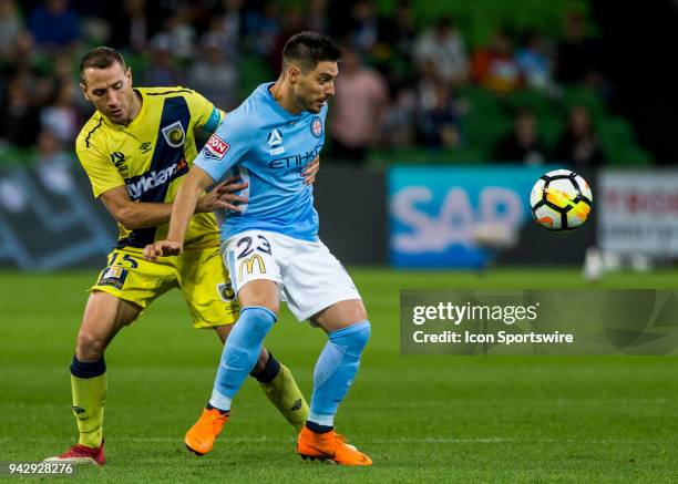 Bruno Fornaroli of Melbourne City and Alan Baro of the Central Coast Mariners contest the ball during Round 26 of the Hyundai A-League Series between...