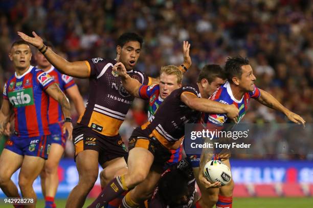 Mitchell Pearce of the Knights is tackled during the round five NRL match between the Newcastle Knights and the Brisbane Broncos at McDonald Jones...